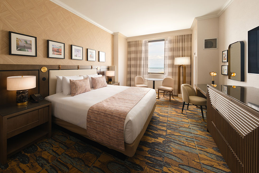 deluxe room bed and full room shot